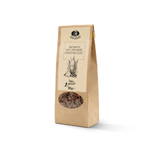 Packung „Wurzelsepp Eierfarbe Dunkelrot – Naturfarbe Krappwurzel“ im beigen Kraftpapierbeutel mit schwarz-weißer Illustration von Osterblumen und einem Ei; ein transparentes ovales Fenster zeigt das Krappwurzel-Färbemittel.