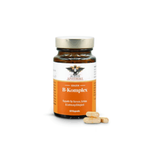 Ein dunkelbraunes Glas mit silbernen Schraubverschluss und orangen Etikett der Grazer B-Komplex Kapseln. Im Vordergrund 4 gelbe Kapseln zur Ansicht.