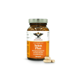 Ein dunkelbraunes Glas mit silbernen Schraubverschluss und orangen Etikett der Grazer Selen Plus Kapseln. Im Vordergrund 4 gelbe Kapseln zur Ansicht.