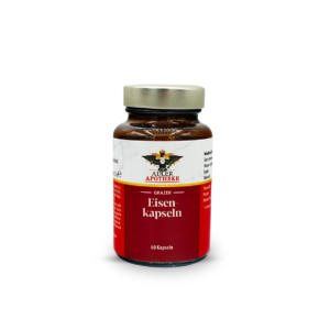 Braunes Glasfläschchen mit silbernem Schraubverschluss, Etikett oben weiß mit Adler-Logo und der Aufschrift "ADLER APOTHEKE", darunter rotes Etikett mit der weißen Aufschrift "Grazer Eisen‑kapseln" und "60 Kapseln."