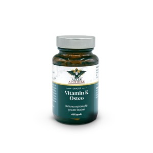 Braune Glasflasche mit silbernem Schraubdeckel und blau-weißem Etikett „Grazer Vitamin K Osteo Kapseln“; Packung mit 60 Kapseln.