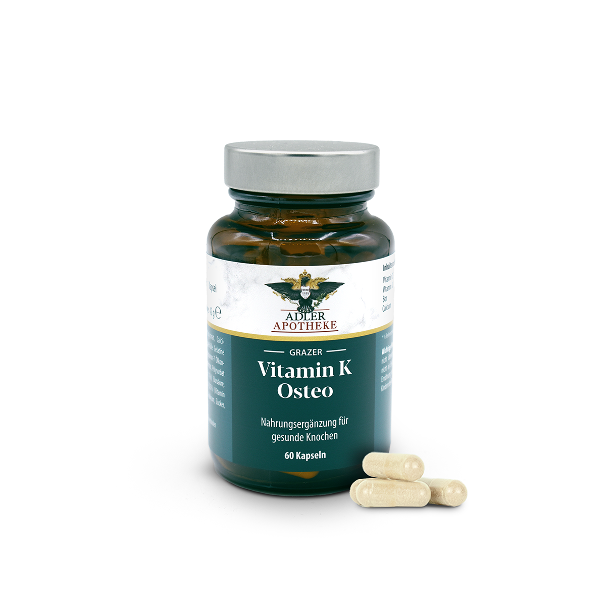 Braune Glasflasche mit silbernem Schraubdeckel und blau-weißem Etikett „Grazer Vitamin K Osteo Kapseln“; mehrere beigerliche Kapseln liegen neben der Flasche, Packung mit 60 Kapseln.