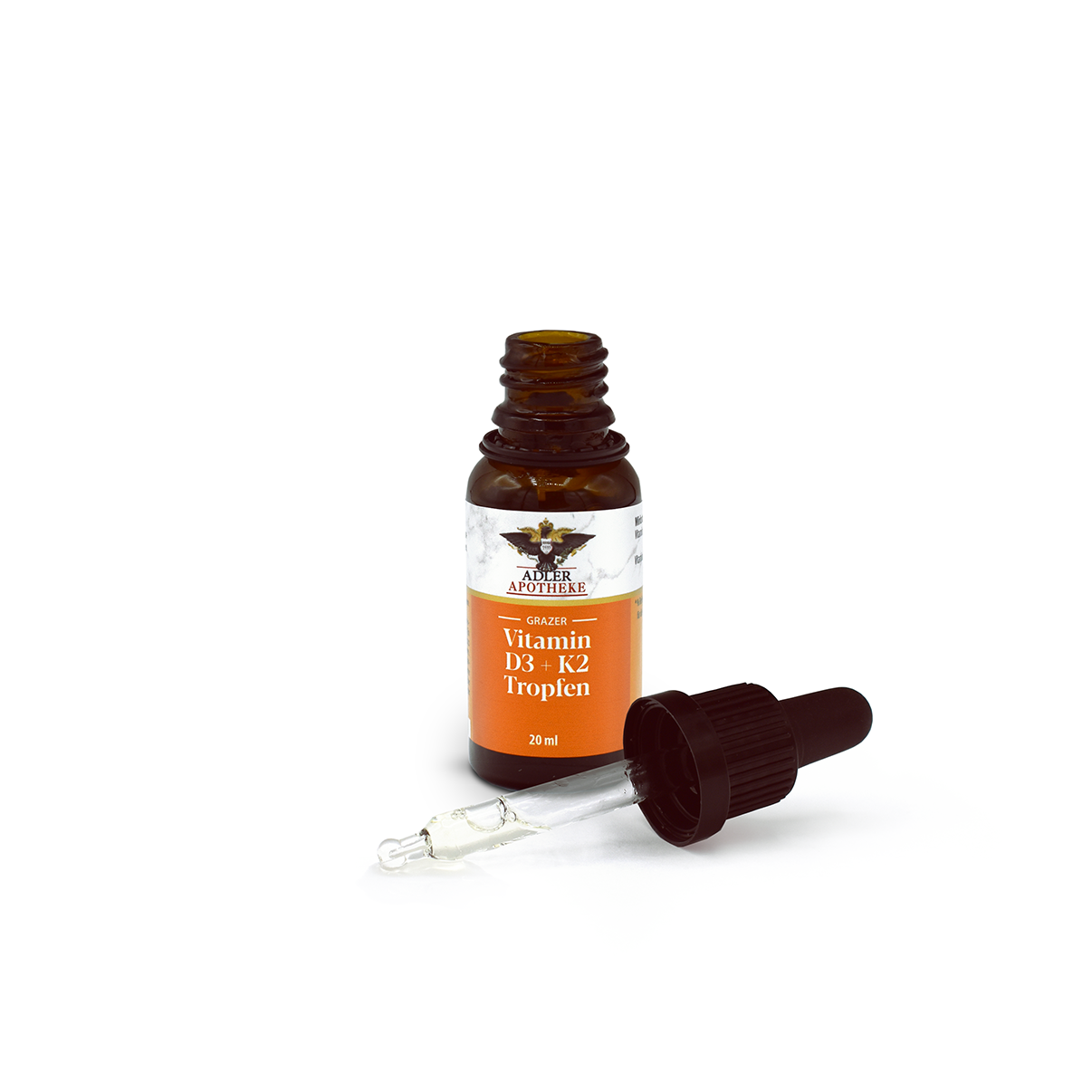 Grazer Vitamin D3/K2 Tropfen; schwarzer Tropfverschluss liegt daneben, Pipette enthält klare Flüssigkeit.